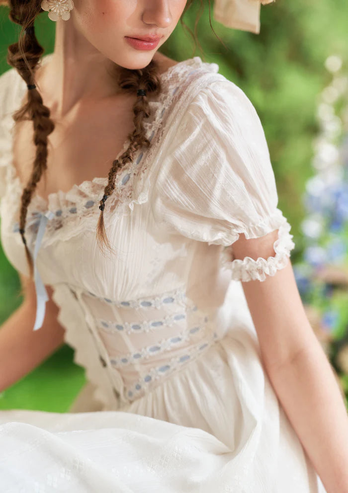 White Cotton Midi Dresses with Square Neck Lace Trim Puff Sleeves Blue Ribbon Accents Lace Corset Waist and Tiered Ruffle Hem