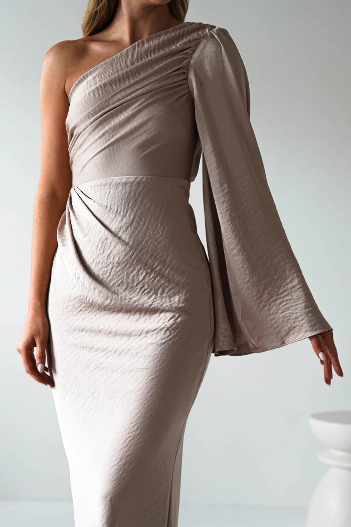 A single long sleeved tight fitting ankle bridesmaid dress suitable for attending weddings