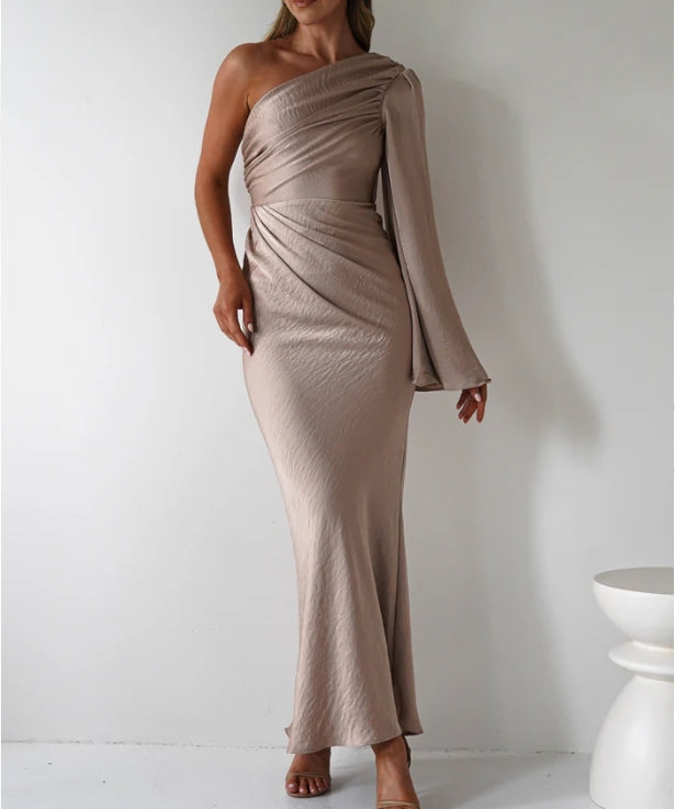 A single long sleeved tight fitting ankle bridesmaid dress suitable for attending weddings