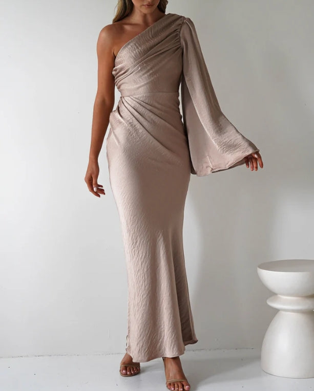 A single long sleeved tight fitting ankle bridesmaid dress suitable for attending weddings