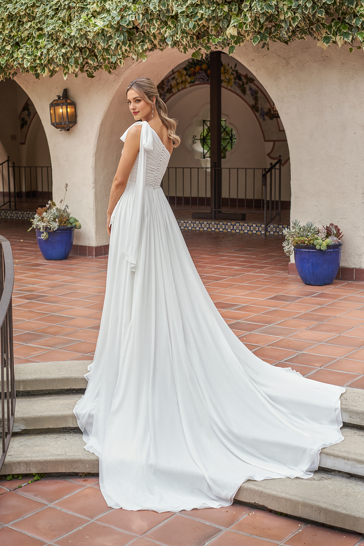 A-line asymmetrical neckline sleeveless strapless backless and floor length wedding dress