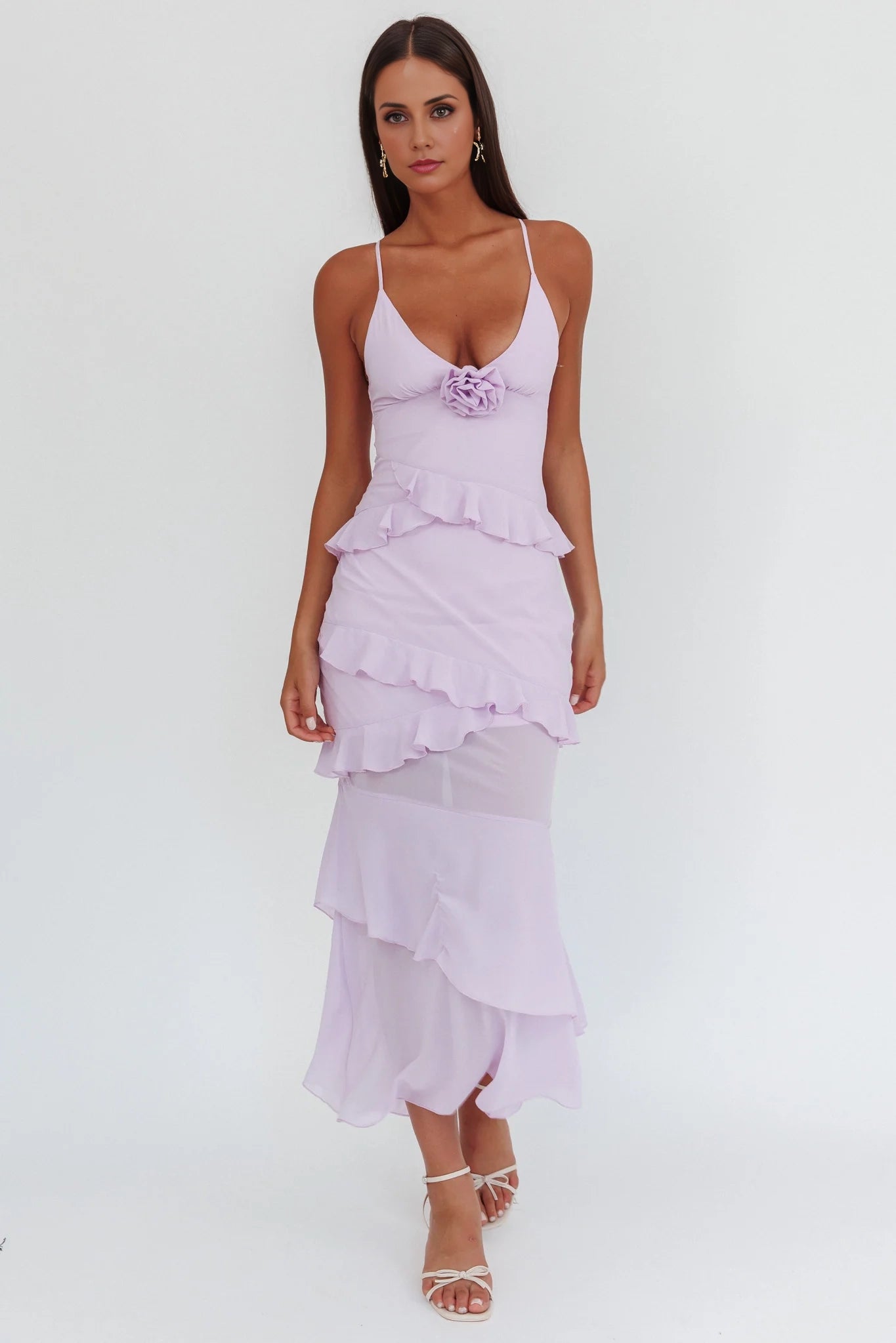 A charming slim fit bridesmaid dress with thin shoulder straps and ruffled rose petals