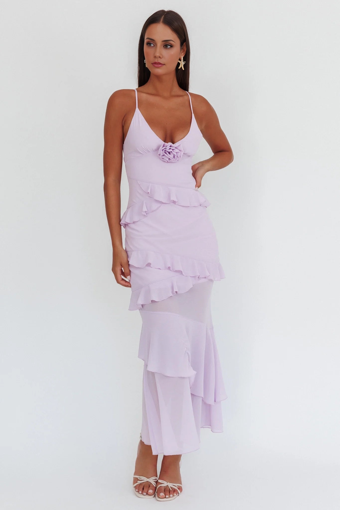A charming slim fit bridesmaid dress with thin shoulder straps and ruffled rose petals