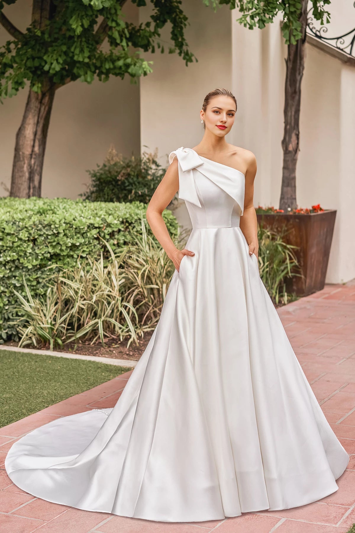 Asymmetric collar sleeveless backless bow shoulder strap and floor length wedding dress