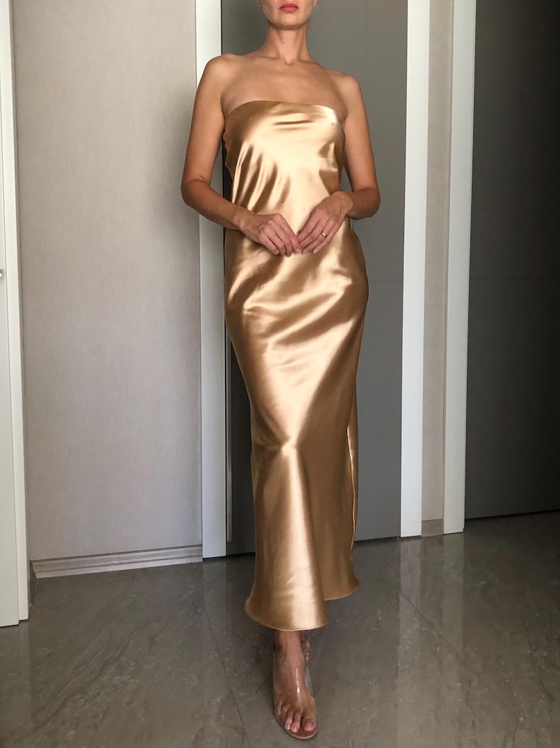 The Minimalist Beige A-line Off The Shoulder Bridesmaid Dress Is Suitable For Wedding Themes