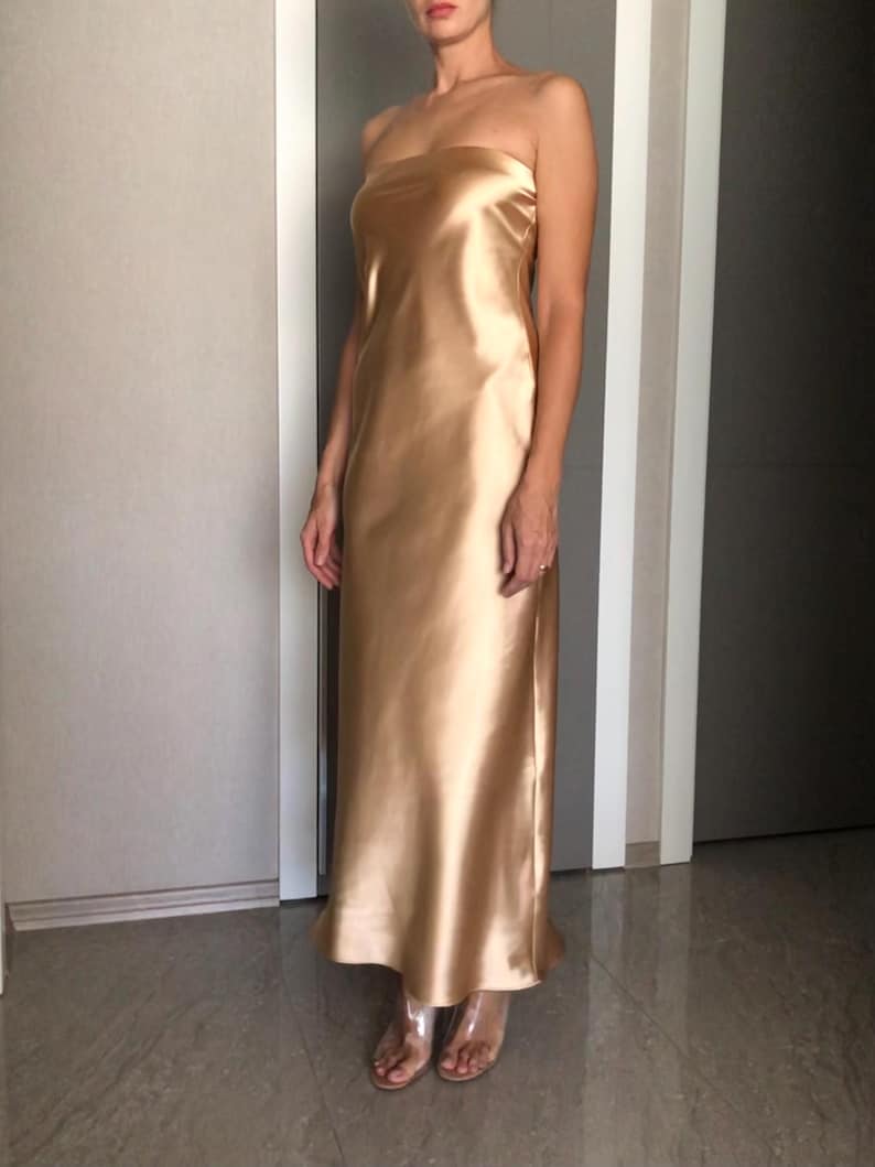 The Minimalist Beige A-line Off The Shoulder Bridesmaid Dress Is Suitable For Wedding Themes