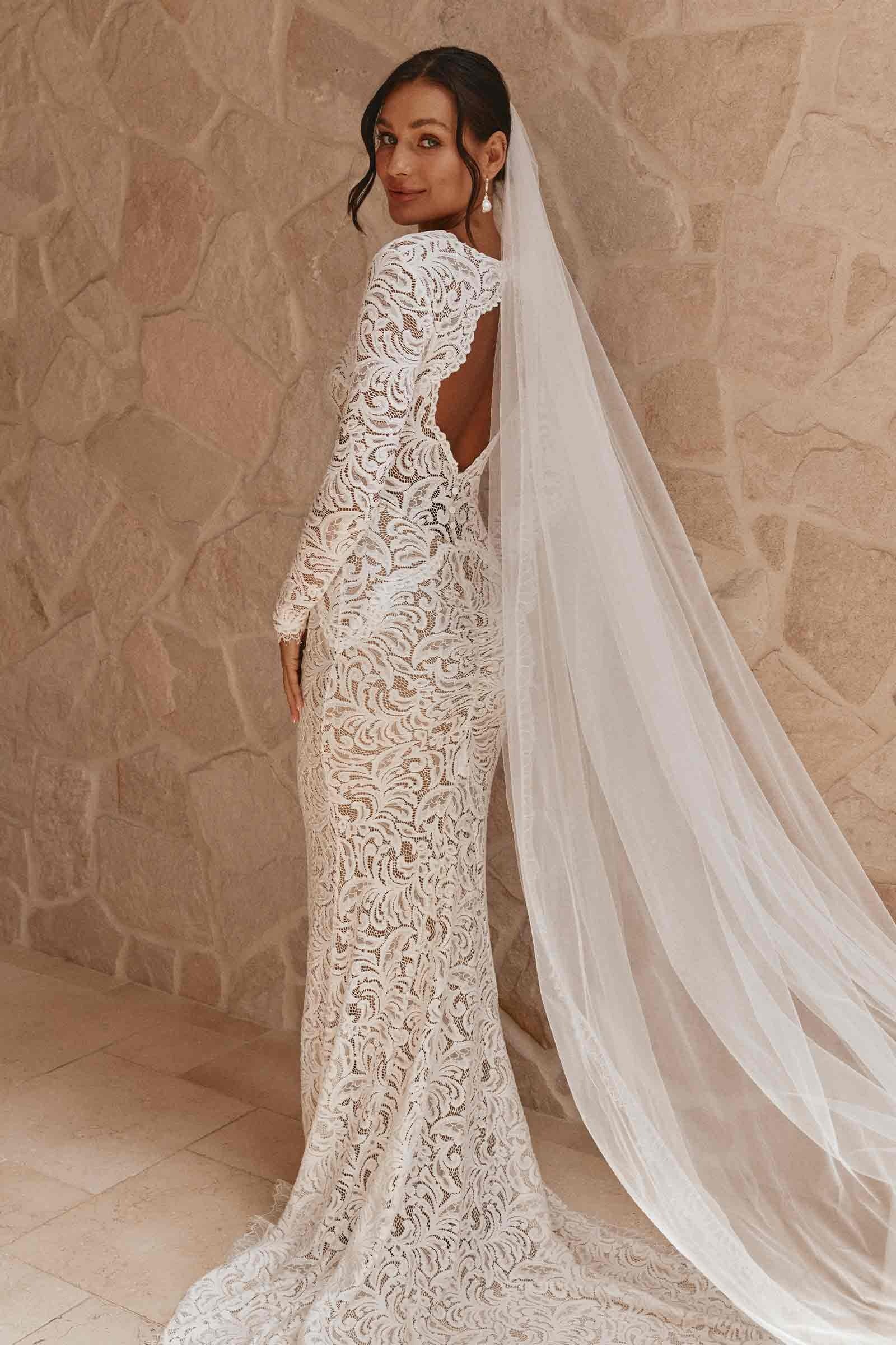 Bohemian Long Sleeve White Lace Mermaid Wedding Dress with Deep V-Back and Scalloped Train