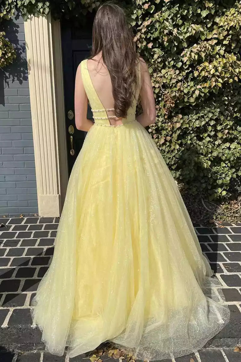 Exquisite and elegant A-line chiffon gently draped deep V-neckline beaded sleeveless cut with exposed back and floor Prom Dresses