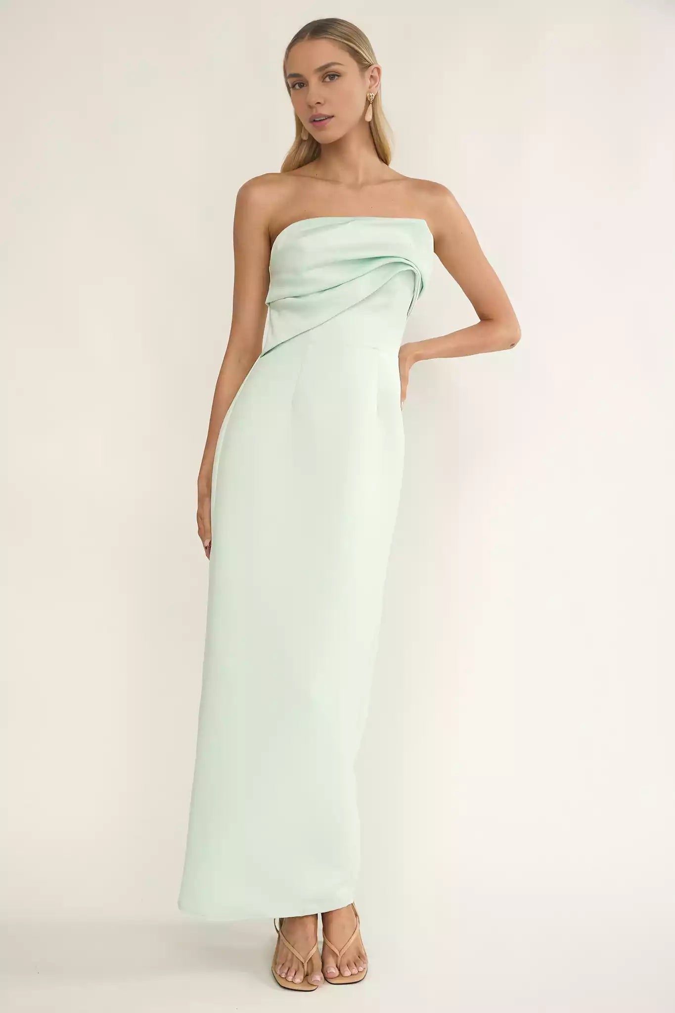 Exquisite strapless pleated details lined with a zipper at the back for a charming look Prom Dresses