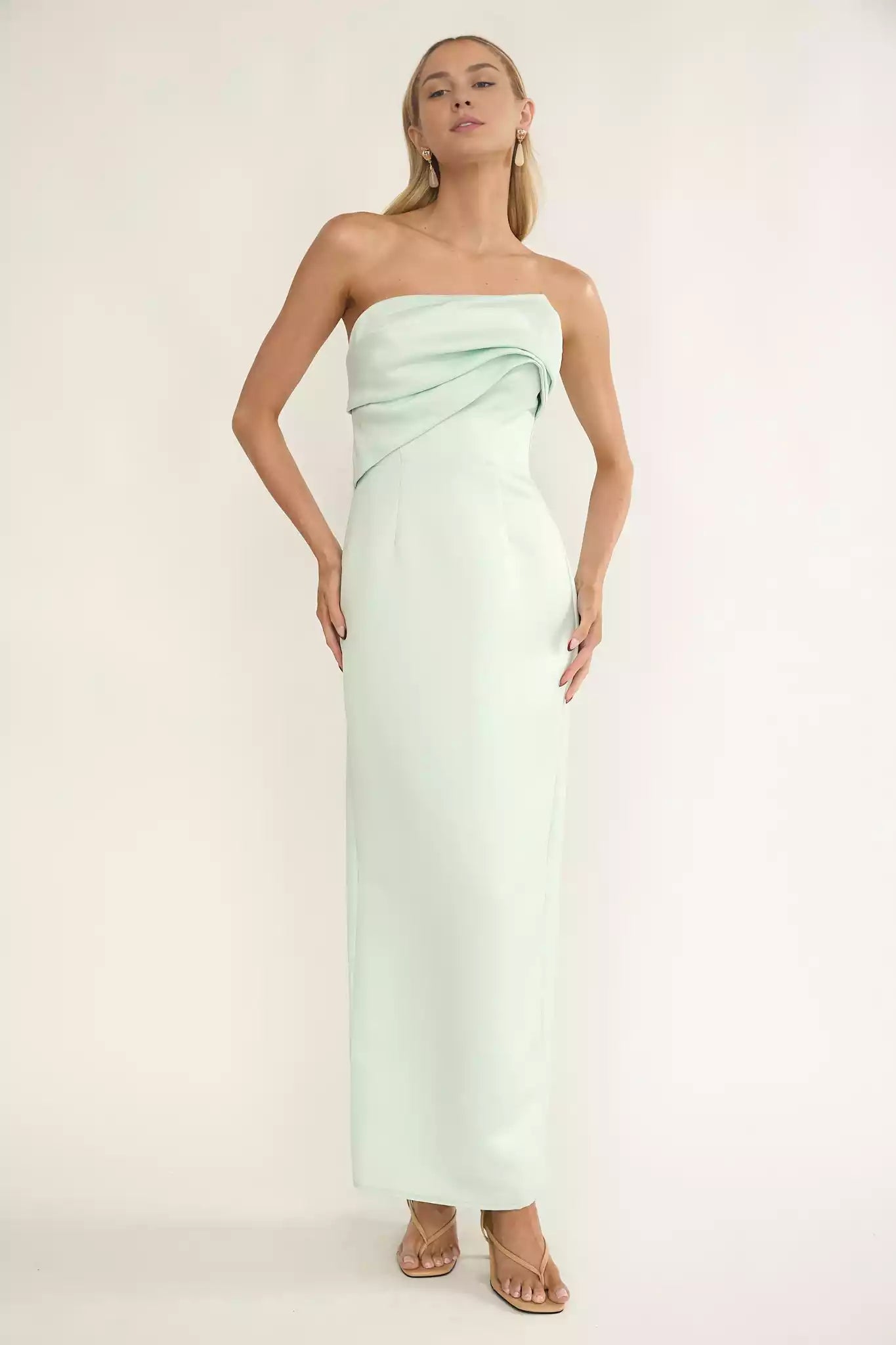 Exquisite strapless pleated details lined with a zipper at the back for a charming look Prom Dresses