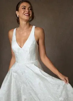 Full A-line skirt with subtle train Floral Jacquard A-Line Wedding Dress with Bow Back