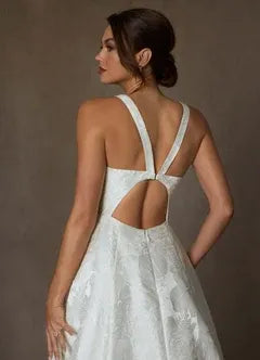 Full A-line skirt with subtle train Floral Jacquard A-Line Wedding Dress with Bow Back