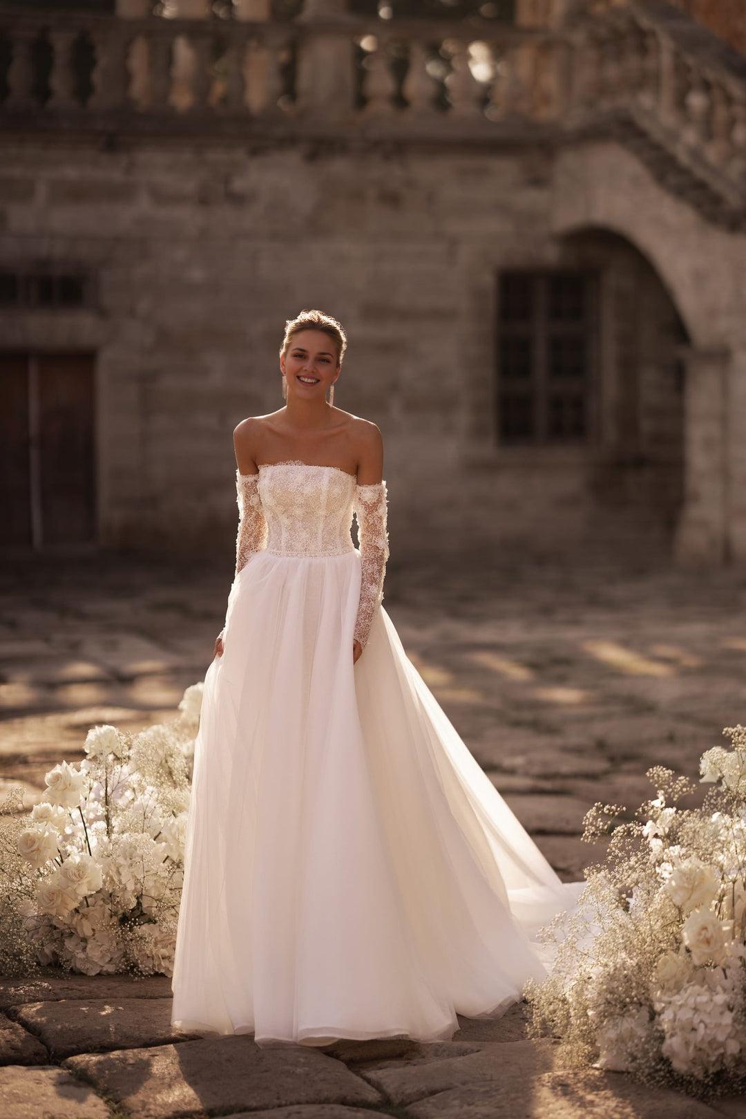 Ivory A-Line Bridal Gown with Embellished Corset and Seamless Skirt Flow