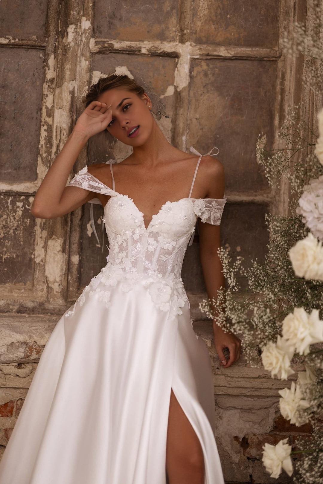 Enchanting Ivory A-Line Wedding Dress with Floral Corset and Delicate Shoulder Bows