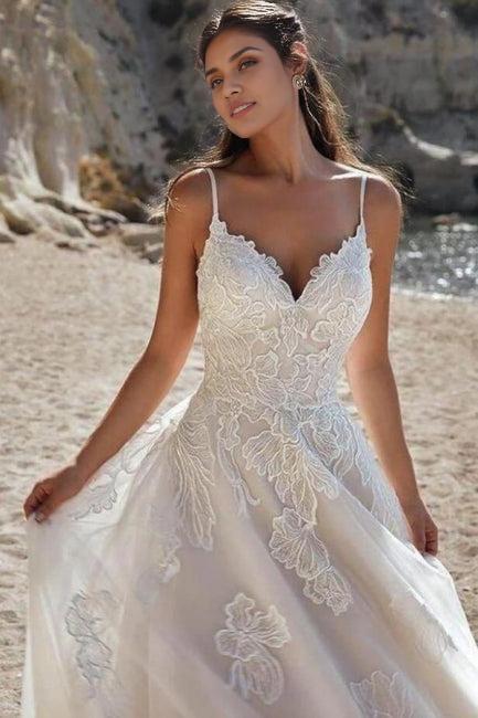 Ivory colored spaghetti length A-line bridal gown