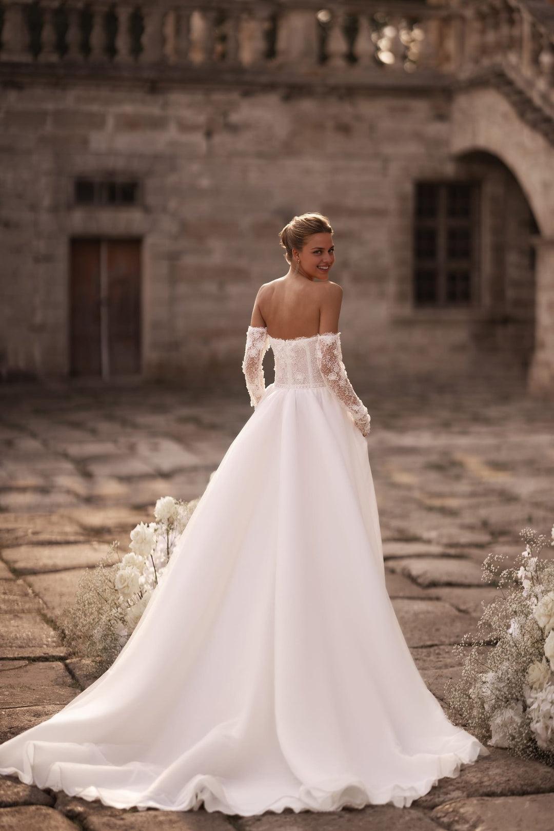 Ivory A-Line Bridal Gown with Embellished Corset and Seamless Skirt Flow