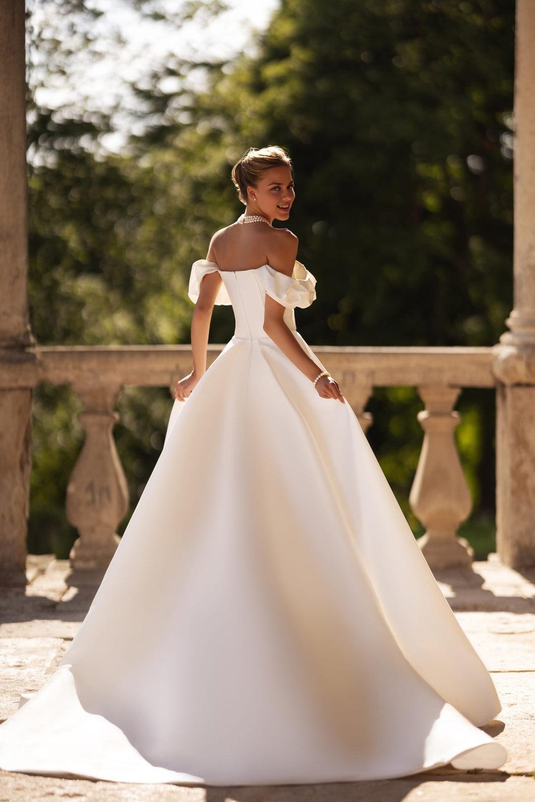 Ivory Off-Shoulder Wedding Dress with Draped Sleeves and Elegant Train