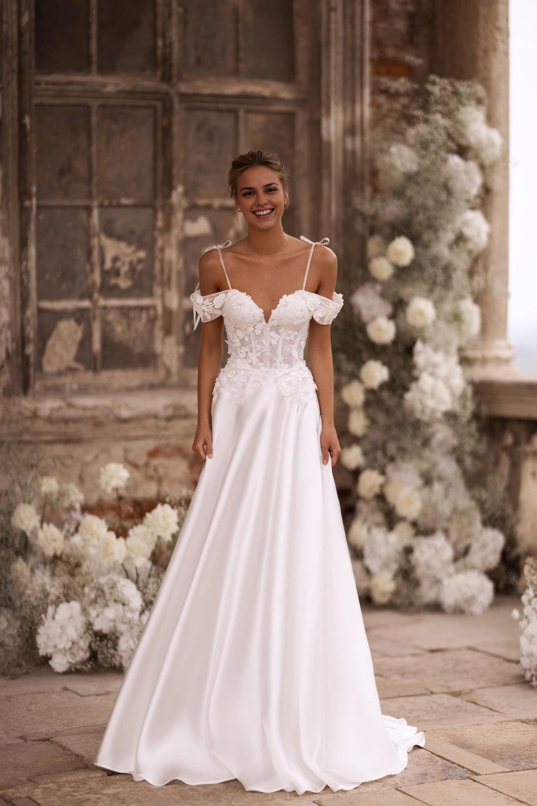 Enchanting Ivory A-Line Wedding Dress with Floral Corset and Delicate Shoulder Bows