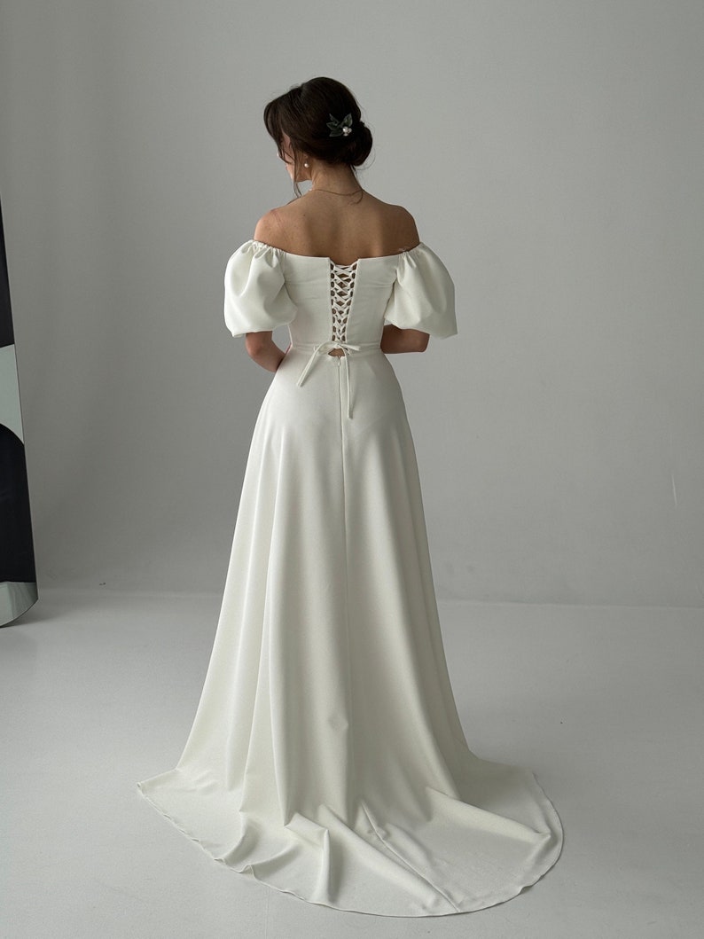 A Modest Dress With Short Sleeves An Ivory-colored Dress A Maxi Wedding Dress A Simple Wedding Dress