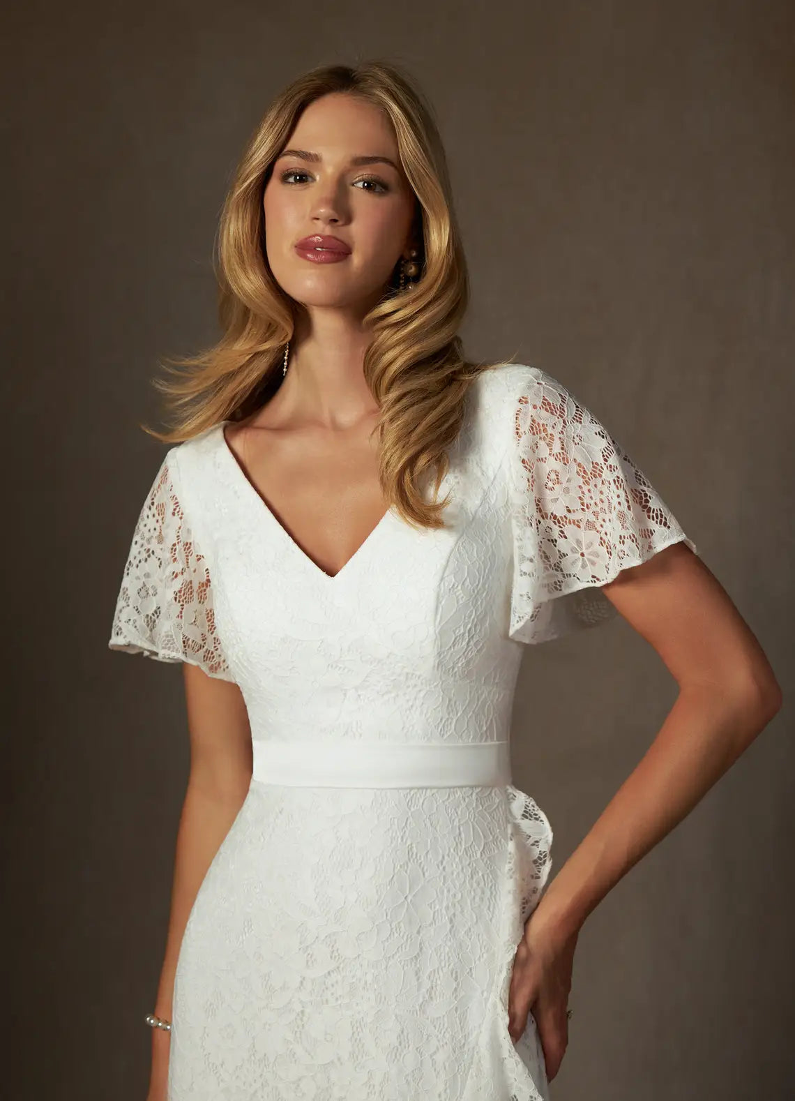 Luxurious floral lace construction V-Neck Lace High-Low Wedding Dress with Flutter Sleeves & Ruffle Hem