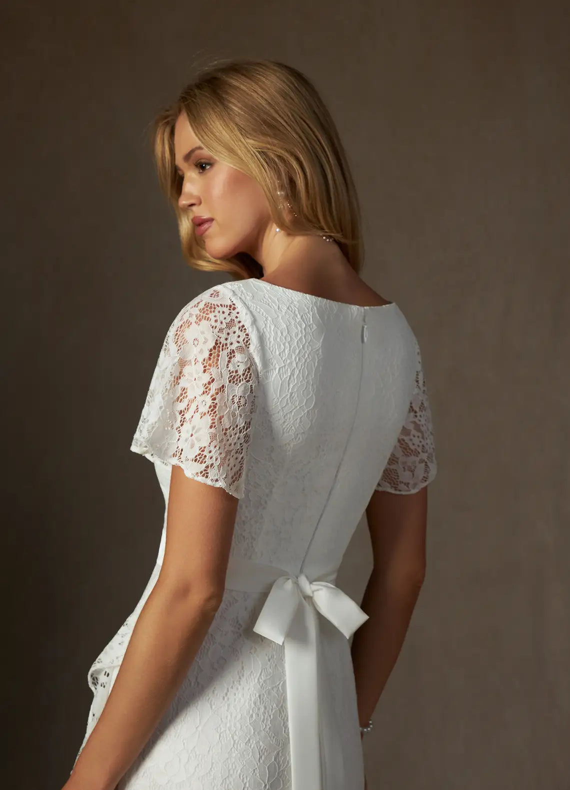 Luxurious floral lace construction V-Neck Lace High-Low Wedding Dress with Flutter Sleeves & Ruffle Hem