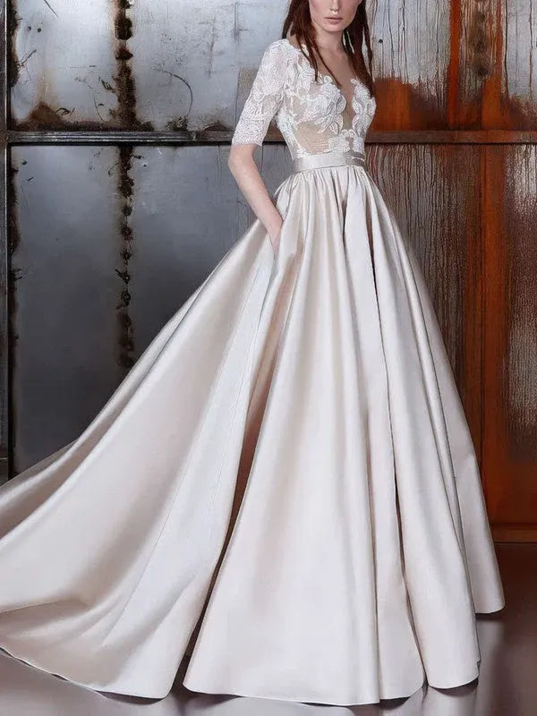 Regal, old-world glamour aesthetic Illusion Lace and Satin Ball Gown Wedding Dress with Half Sleeves