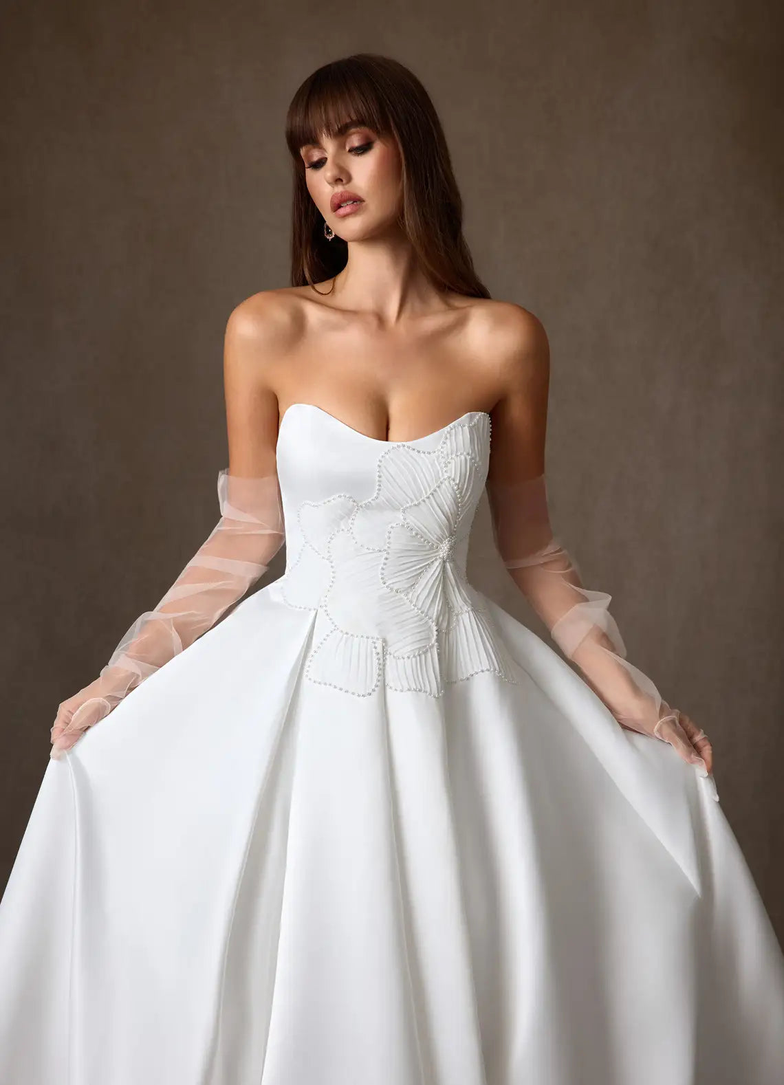 Voluminous ball gown skirt with subtle train Strapless Satin Ball Gown Wedding Dress with Floral Beaded Bodice