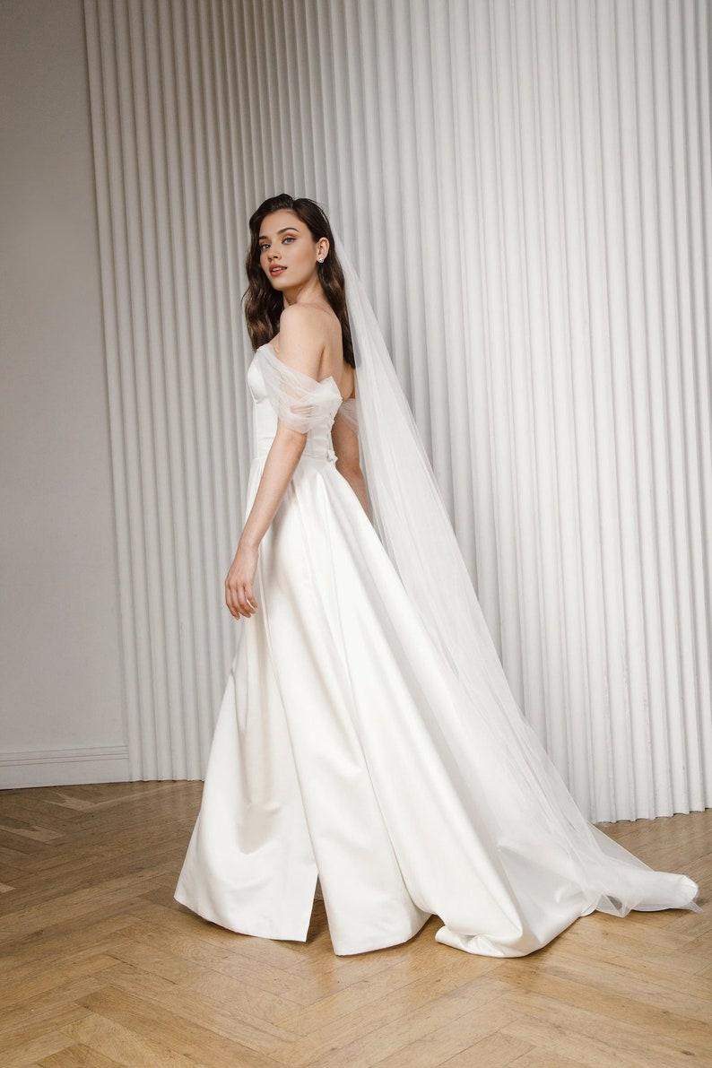 A Line Wedding Dress Made Of Satin Romantic And Modern Wedding Dress