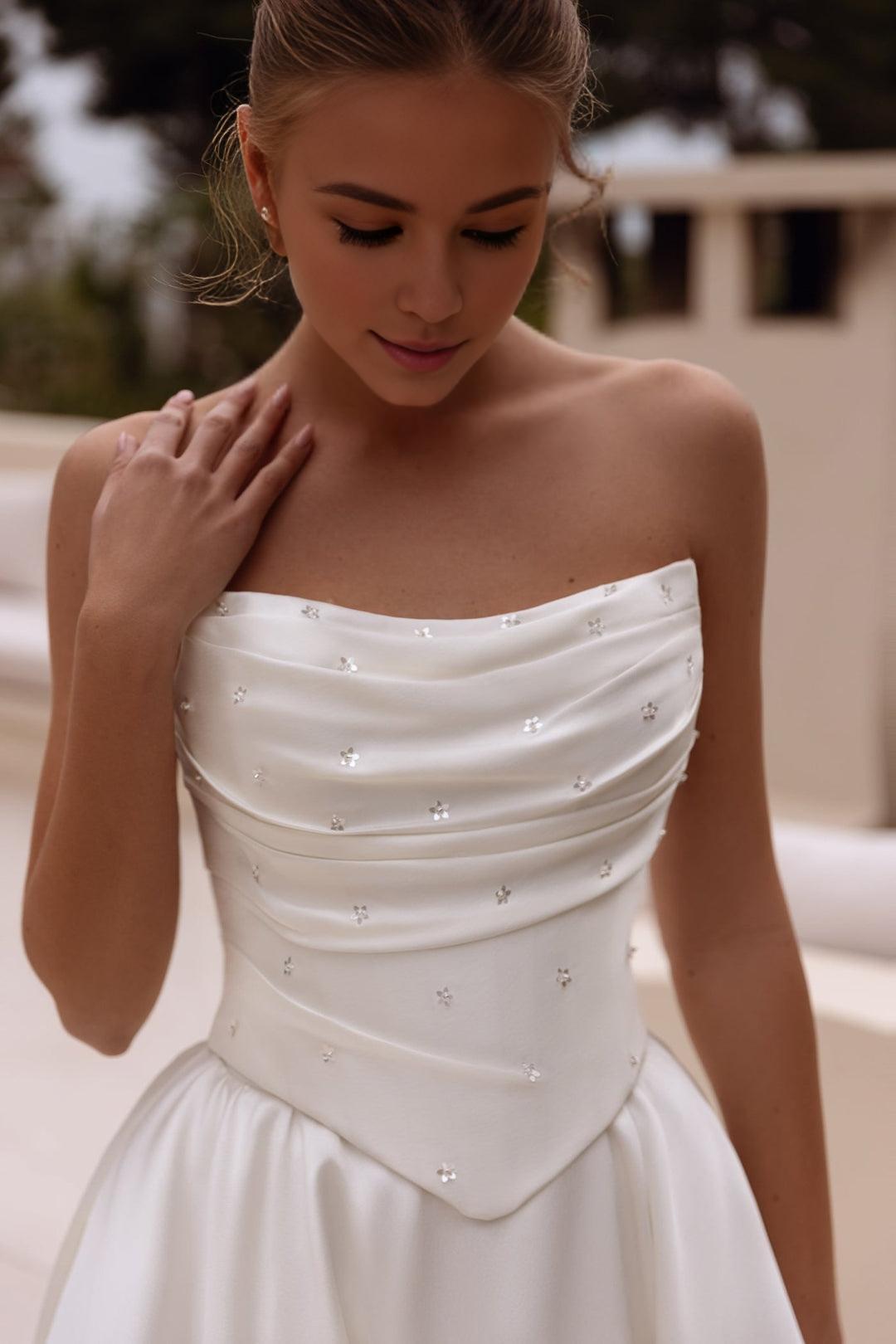 White Strapless Satin Ball Gown Wedding Dress with Long Flowing Train