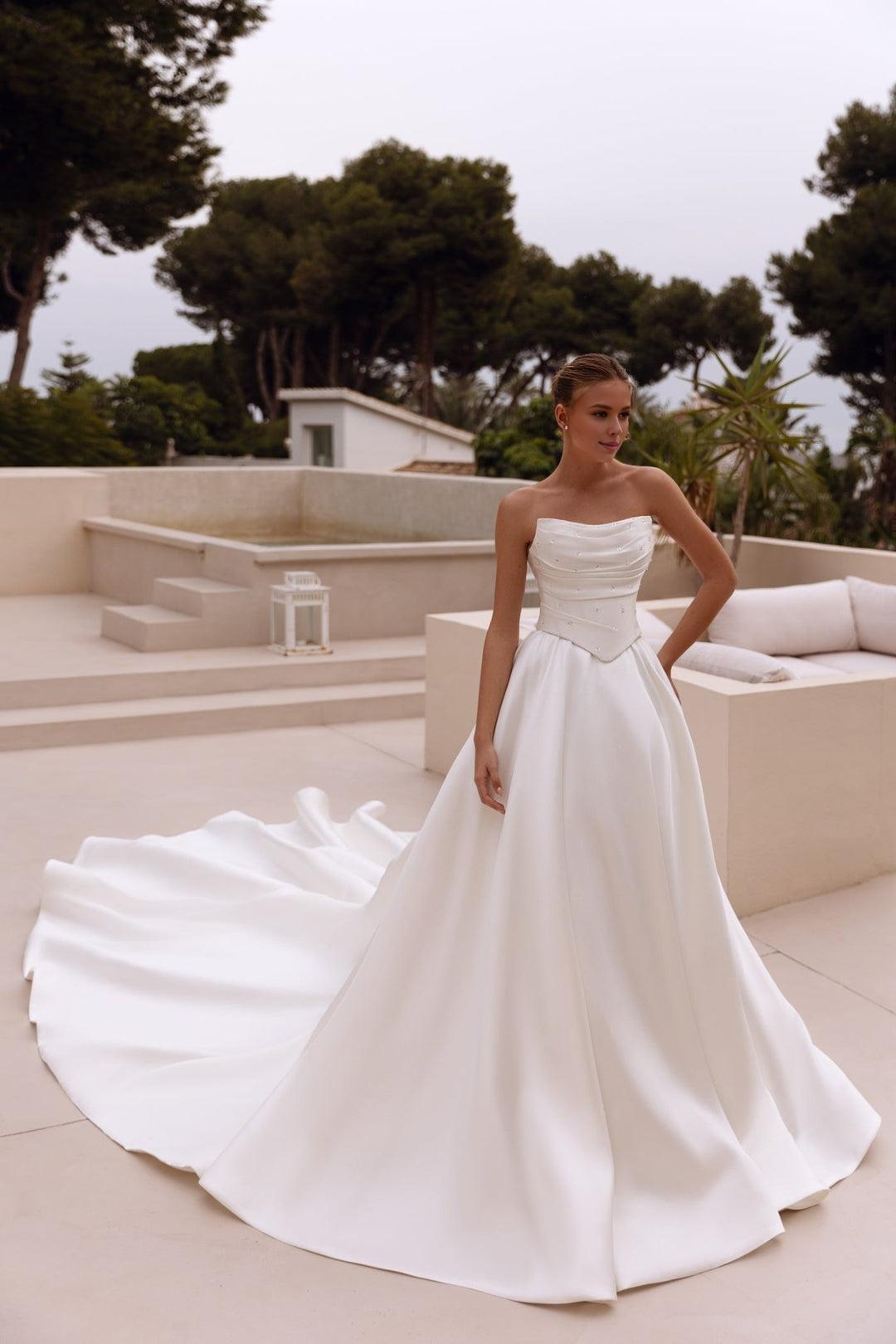 White Strapless Satin Ball Gown Wedding Dress with Long Flowing Train