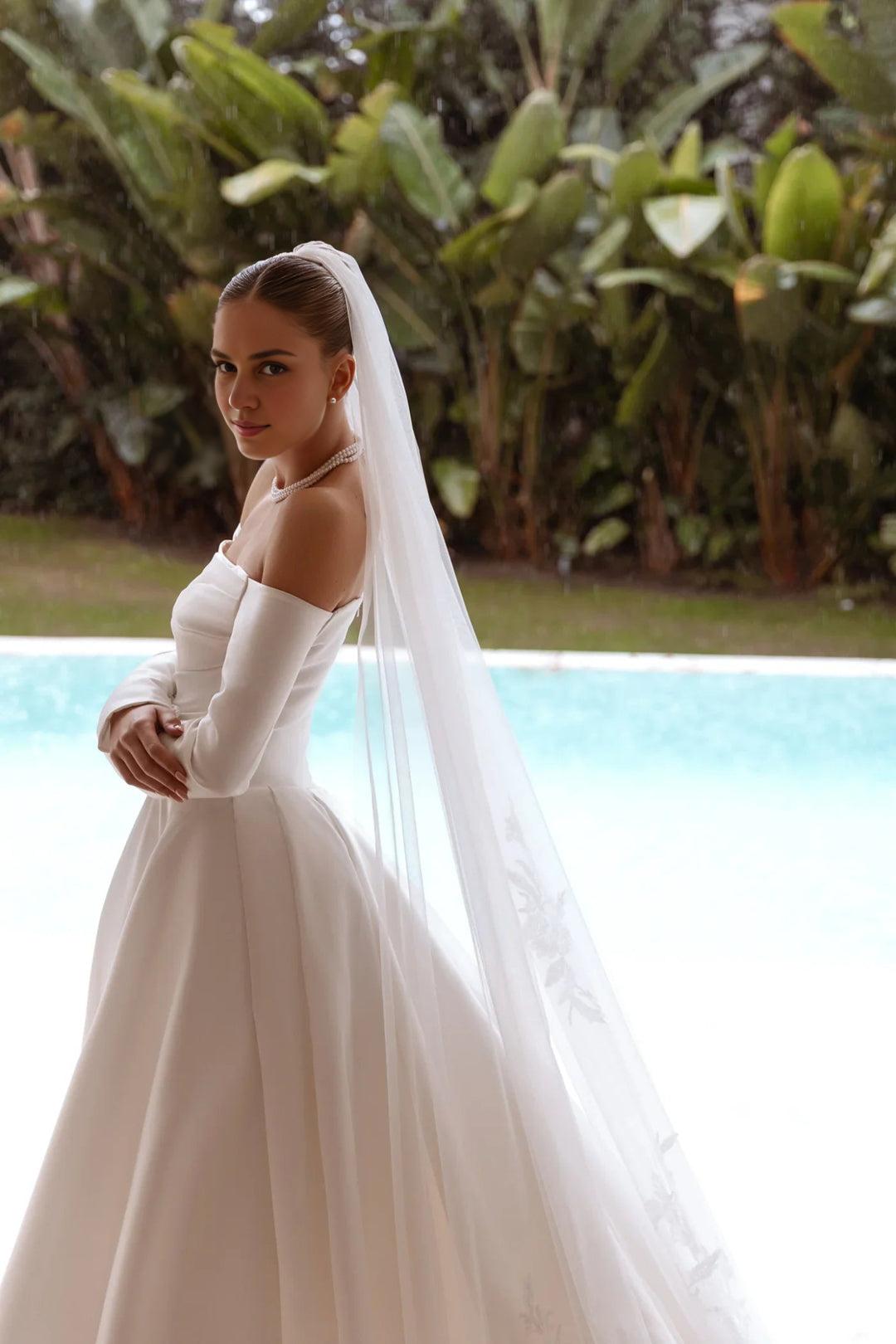 White Off-Shoulder Satin Wedding Dress with Long Sleeves and Floor-Length Train