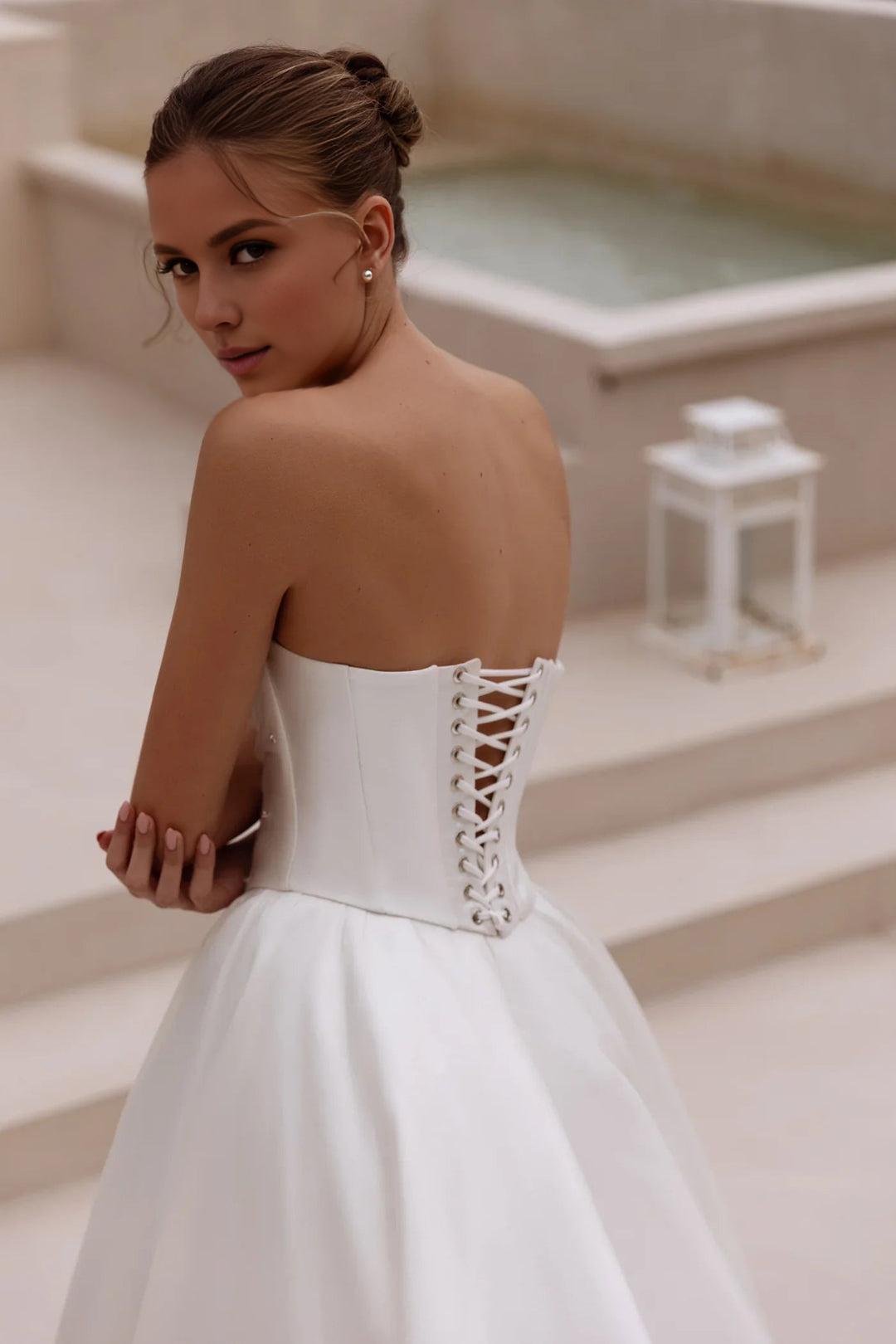White Strapless Satin Ball Gown Wedding Dress with Long Flowing Train
