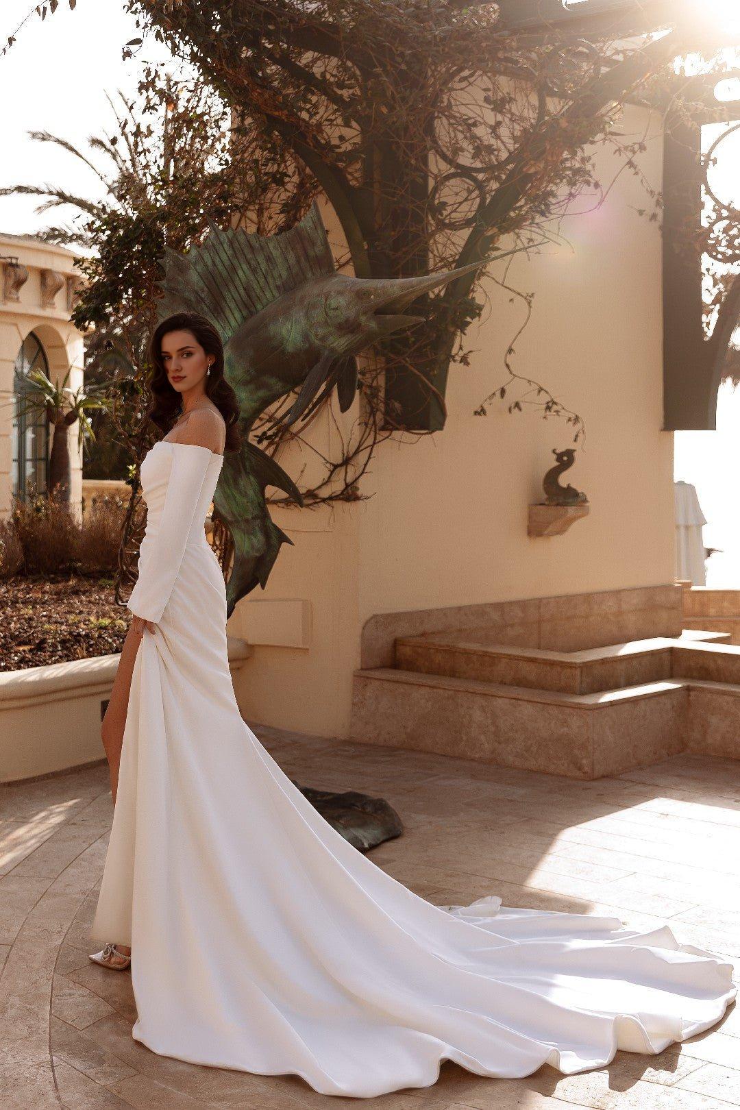 White Off-Shoulder Long-Sleeved Wedding Dress with High Slit and Flowing Train