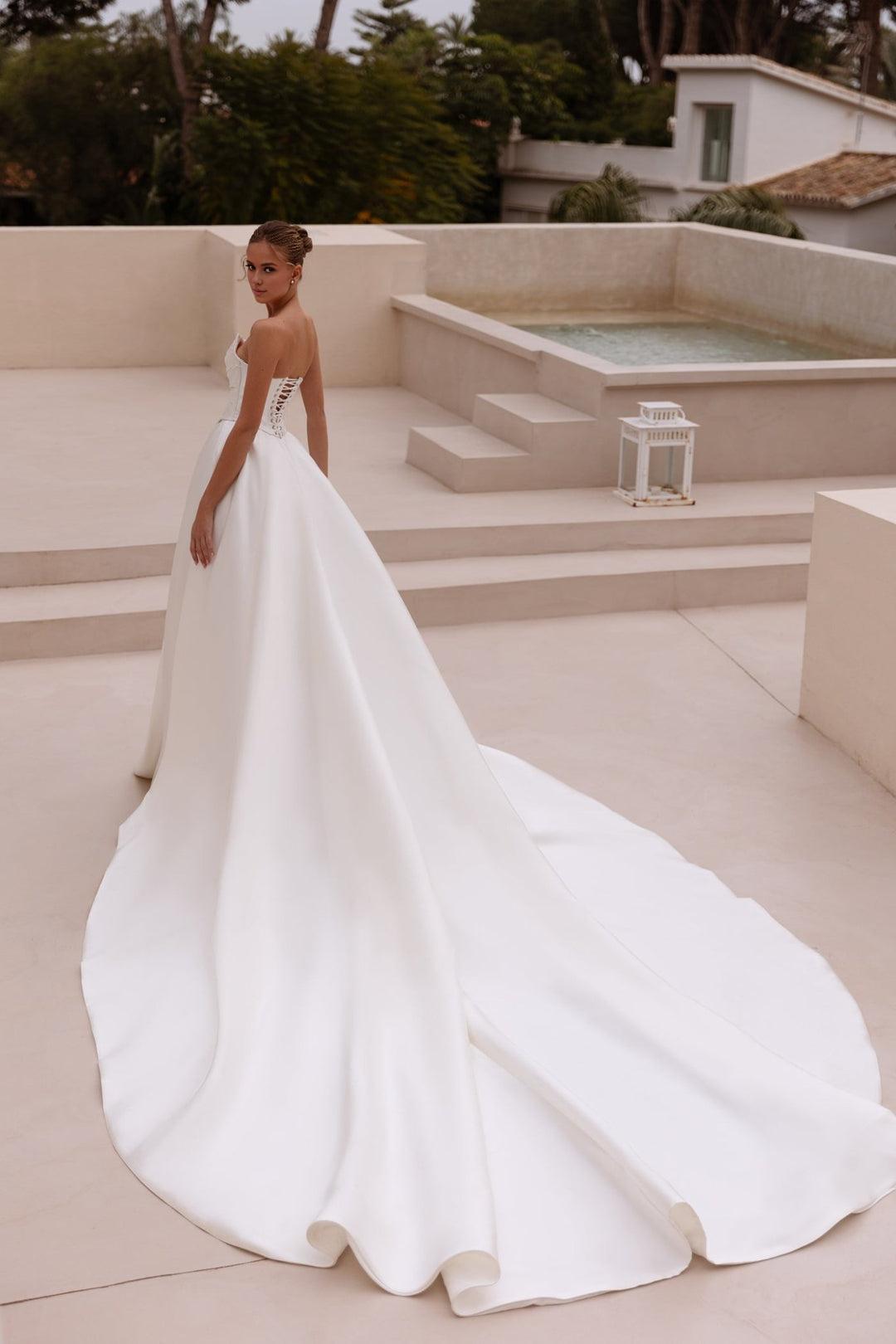 White Strapless Satin Ball Gown Wedding Dress with Long Flowing Train