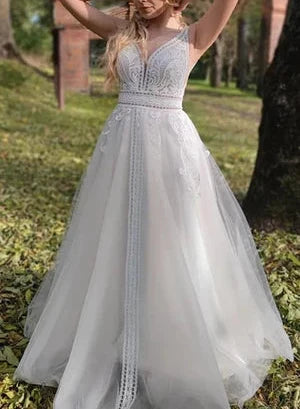 Sleeveless A-Line Lace Wedding Dress With V-neck And Low-V Back